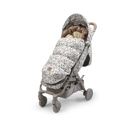 Dalmatian Dots Fußsack in stroller, perfect for winter warmth with insulated panels and modern design. Ideal for style-conscious parents.