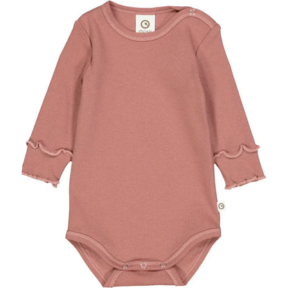 Pink long-sleeved baby bodysuit with ruffled cuffs made from soft ribbed fabric.