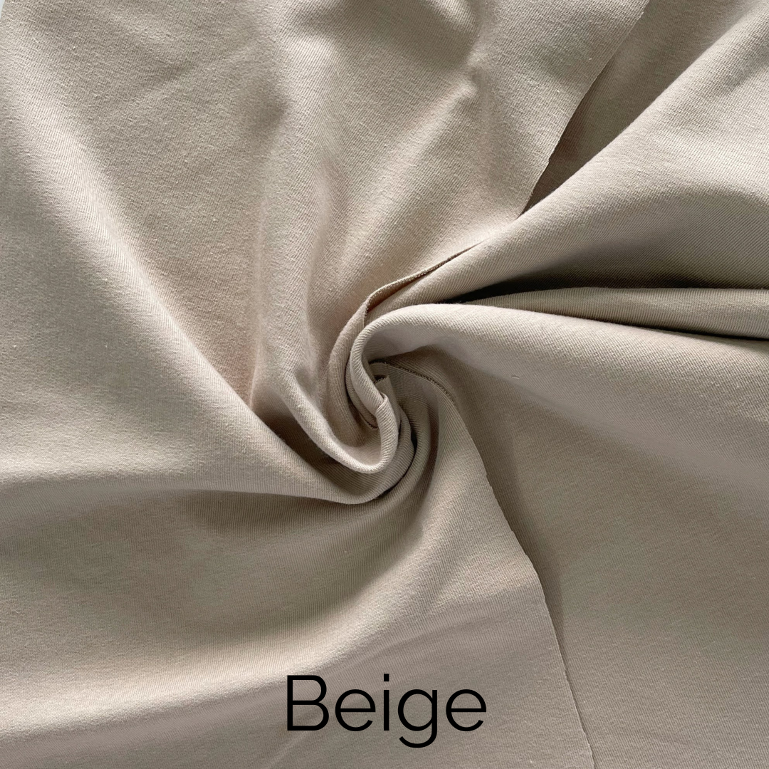 Beige, weaved fabric showing a soft, smooth texture ideal for home decor and upholstery projects.