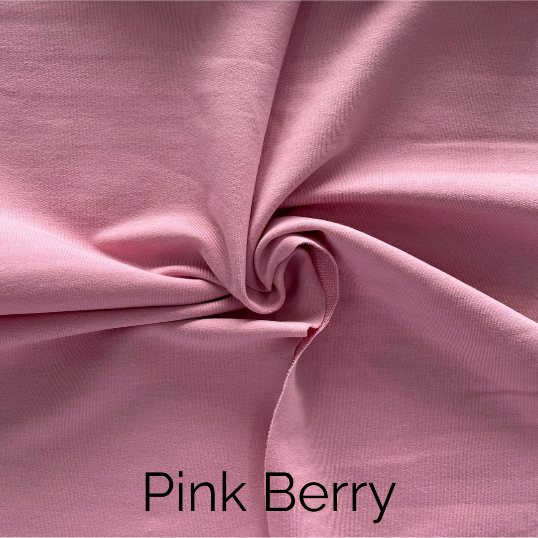 Close-up of Pink Berry fabric showing its smooth texture and soft color.