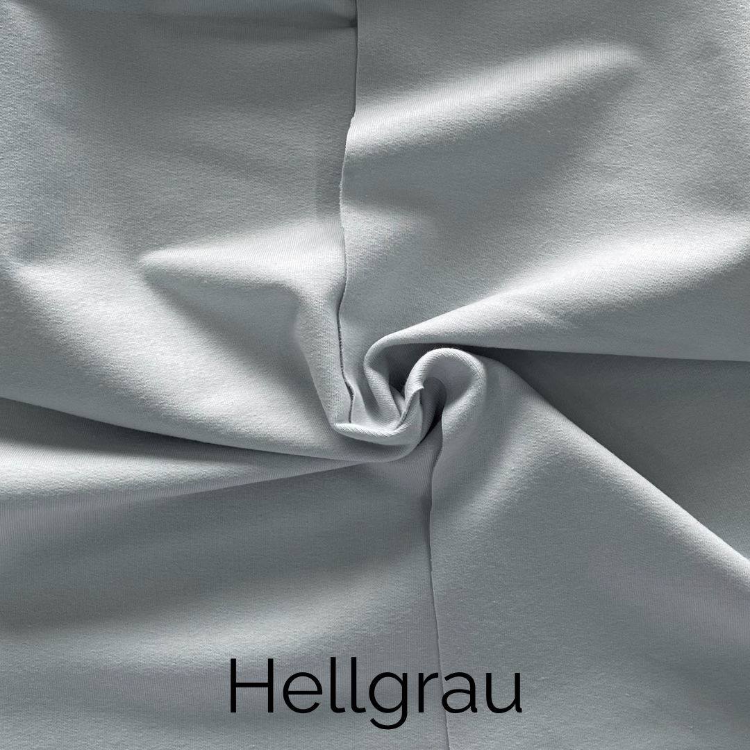 Hellgrau Jersey-Stoff mit kunstvoll geknoteter Textur für modernes Knotenkissen-Design.