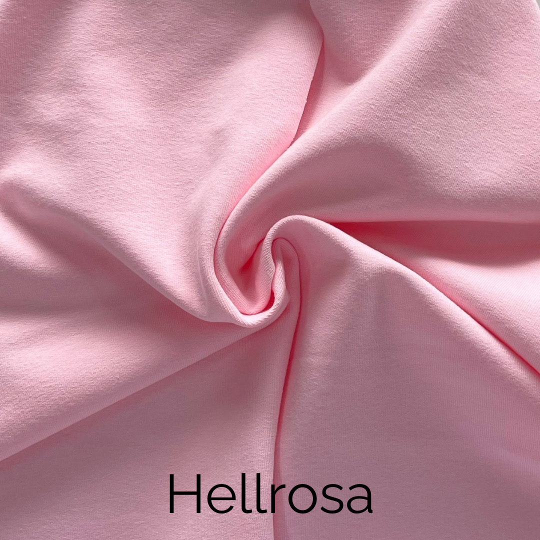 Hellrosa Jersey-Stoff, weich und dehnbar, ideal für handgefertigte Knotenkissen und andere textile Designs.